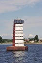 lighthouse with a solar battery near the sea channel near Kronstadt