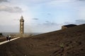 Lighthouse stands in lava field