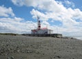 Lighthouse Straits of Magellan with shore, clouds, Punta Delgada, Chile