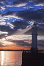 Lighthouse at sunset with light beam Royalty Free Stock Photo