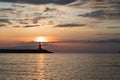 Lighthouse at sunset and magnificent sky with textured clouds