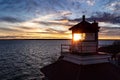 Lighthouse at sunset on Lake Huron.