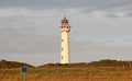 Lighthouse at sunset in the twilight. Egmond aan Zee, North Sea, the Netherlands.