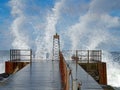 Lighthouse in swell with splashing waves on the Danish North Sea coast of VorupÃÂ¸r