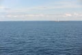 Lighthouse on a tiny uninhabited island in Skagerrak Strait between Sweden and Norway on a sunny day with blue sky, navy blue sea