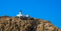 The lighthouse on the top of the red granit La Pietra islands, L`ÃÅ½le-Rousse, Corsica