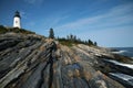 Lighthouse Tower Above Unique Rock Formations in Maine Royalty Free Stock Photo