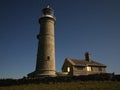 Lighthouse under a starry night sky. Lundy Island, Devon Royalty Free Stock Photo