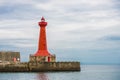 Lighthouse under sunburst