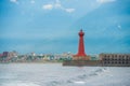 Lighthouse under sunburst