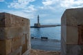 Lighthouse at Venetian harbour of the Old Town of Chania Crete, Greece. View from Firkas Fortress