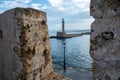 Lighthouse at Venetian harbour of the Old Town of Chania Crete, Greece. View from Firkas Fortress