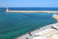 lighthouse, venitian port and mediterranean sea in chania in crete (greece)