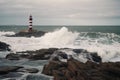 lighthouse, with view of the open sea, waves crashing against the rocks Royalty Free Stock Photo