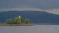 Lighthouse on the Volga river against the background of mountains