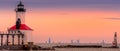 Michigan City, Indiana / USA 05/21/2019: Lighthouse During golden Hour with Chicago in the background Royalty Free Stock Photo