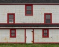 Lighthouse windows on weathered wooden wall