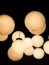 Lighting ball hanging from the ceiling on the black background. Royalty Free Stock Photo