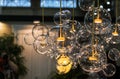 Lighting balls on the chandelier in the lamplight, light bulbs hanging from the ceiling Royalty Free Stock Photo