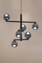Lighting balls on the chandelier in the lamplight, light bulbs hanging from the rail Royalty Free Stock Photo