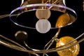 Lighting balls on the golden chandelier in the lamplight, Lamps on the dark background. Close-up Royalty Free Stock Photo