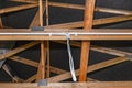 Lighting cables in plastic wiring pipes in a newly built house mounted on roof trusses. Royalty Free Stock Photo