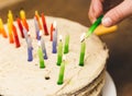 Lighting Candles on a Birthday Cake Royalty Free Stock Photo