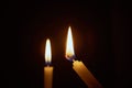 The lighting candles, Burning candle on black background, Candlelit in the dark, Candle flame at night. Lighting design for the ba Royalty Free Stock Photo