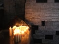 Lighting candles in chapel of Our Lady from the Kamenita vrata Stone Gate in Zagreb to remember and honor the deceased loved