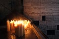 Lighting candles in chapel of Our Lady from the Kamenita vrata Stone Gate in Zagreb to remember and honor the deceased loved