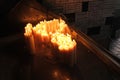 Lighting candles in chapel of Our Lady from the Kamenita vrata Stone Gate in Zagreb to remember and honor the deceased loved