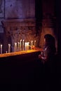 Lighting candles at the Church of the Holy Sepulchre Royalty Free Stock Photo