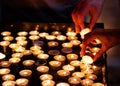 Lighting candles in a church