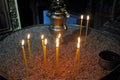 Lighting candles inside a Christian orthodox church. Royalty Free Stock Photo