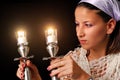 Lighting the candles for Jewish Sabbath
