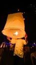 Lighting candles, lanterns in the sky at night in the Lantern Festival