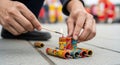 Lighting colorful firecrackers with a matchstick during a celebration Royalty Free Stock Photo