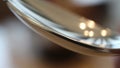 Lighting creates reflections on the spoon, highlighting its smooth, shiny Royalty Free Stock Photo