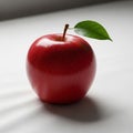 The lighting creates a soft shadow beneath the apple, emphasizing its Royalty Free Stock Photo