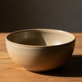 Lighting creates a warm shadow inside and alongside the bowl, highlighting Royalty Free Stock Photo