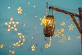 Lighting decor at party outdoors. Cozy lights lanterns, light garland background Royalty Free Stock Photo