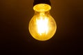 Lighting decor. Retro light bulb. Old dirty lamp dimly lit for Halloween. Selective focus. Royalty Free Stock Photo