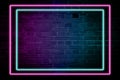 Lighting Effect frame pink and blue neon on brick wall for background party or your text Royalty Free Stock Photo