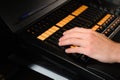 A lighting engineer works with lights technicians control on the concert show. Professional light mixer, mixing console Royalty Free Stock Photo