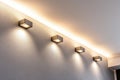 Lighting equipment on the wall in the living room. Spotlights under the ceiling. Track LED-lighting system Royalty Free Stock Photo