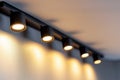 Lighting equipment on the wall in the living room. Spotlights under the ceiling. Track LED-lighting system Royalty Free Stock Photo