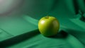 The lighting highlights the apple s shine casting subtle shadows Royalty Free Stock Photo
