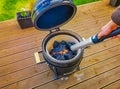 Lighting a Kamado type barbecue grill with an electrical charcoal lighter