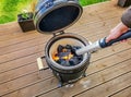 Lighting a Kamado type barbecue grill with an electrical charcoal lighter