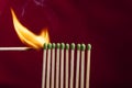 Lighting matches in a row. Royalty Free Stock Photo